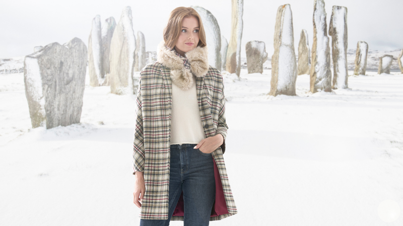 Model at Callanish Stones wearing Callanish Harris Tweed jacket