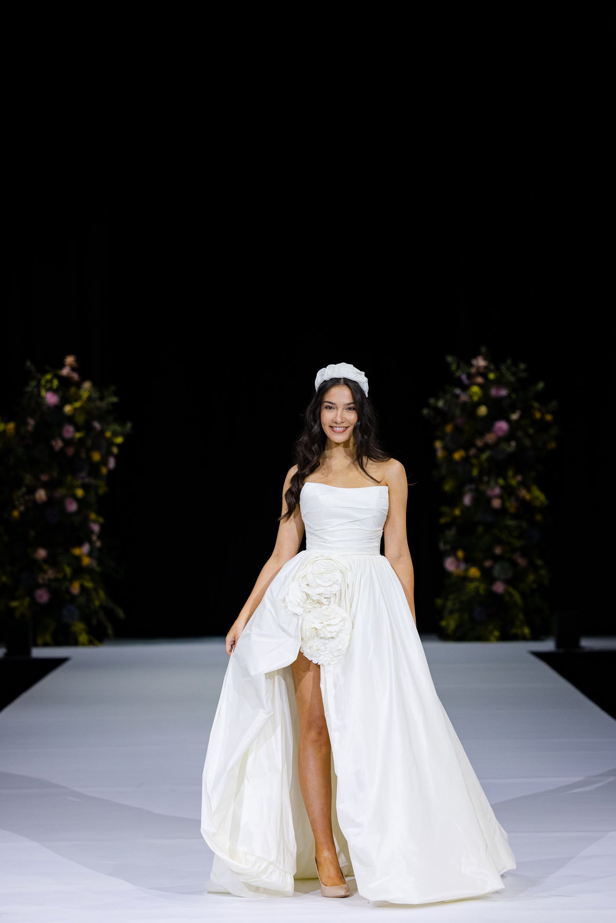 Contemporary wedding dress with puffball hem and high front slit