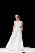 Youthful beaded lace wedding dress with dramatic back