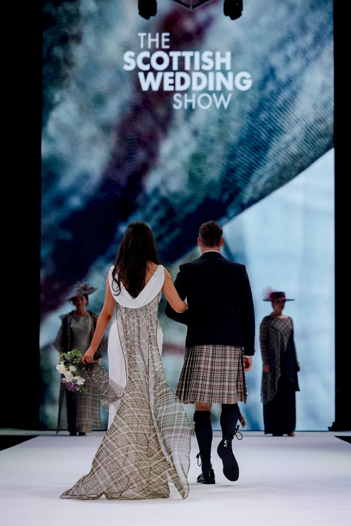 Drape front wedding dress with detachable tartan organza train